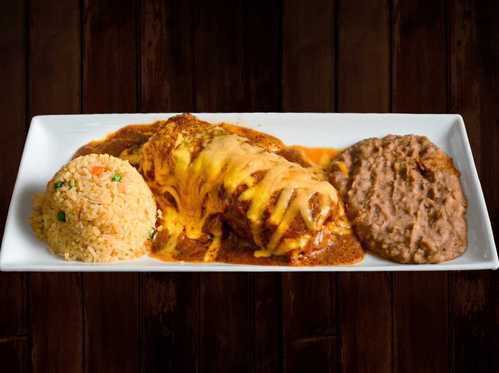 Chiles rellenos in sauce with Spanish rice