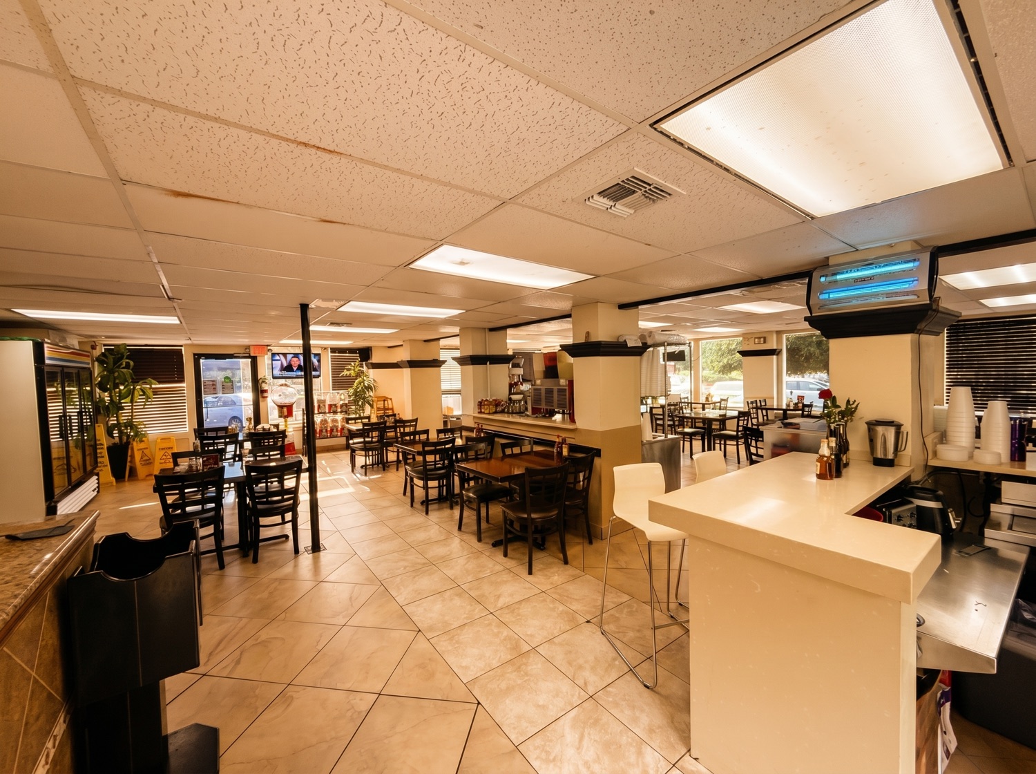Casual dining area with a TV at Mi Guadalajara — catch the game